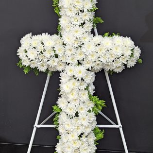 White cross flowers as funeral tribute