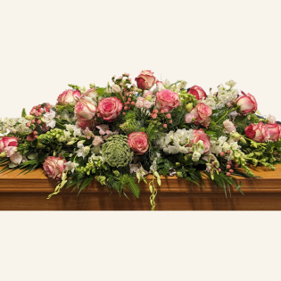 Order a garden casket cover in Belfield, Sydney. My Sister’s Keeper features white roses with soft reddish-pink edging and seasonal fillers for a whimsical garden look. Available in small, medium, long & full cover lengths. Funeral flower delivery across Inner West, Canterbury-Bankstown, Strathfield & Burwood by Belfield Blooms.