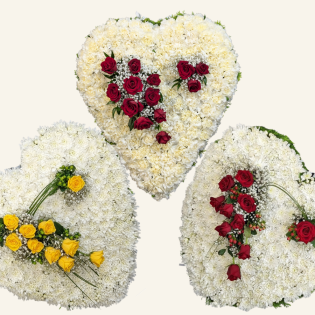 HEART & SOULS Heart Tribute A striking rose heart tribute with a 3D spray of red or yellow roses, finished on a chrysanthemum or carnation base.