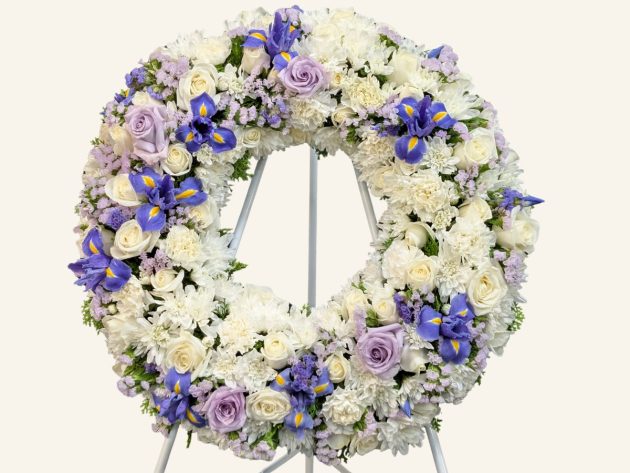 Blue Jay purple and white funeral wreath by Belfield Blooms Sydney