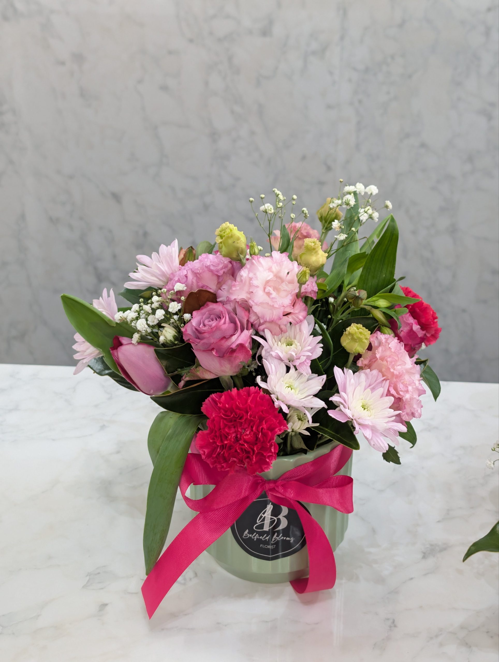 Ceramic vase flower arrangement with soft pastel blooms Sydney florist Belfield Blooms